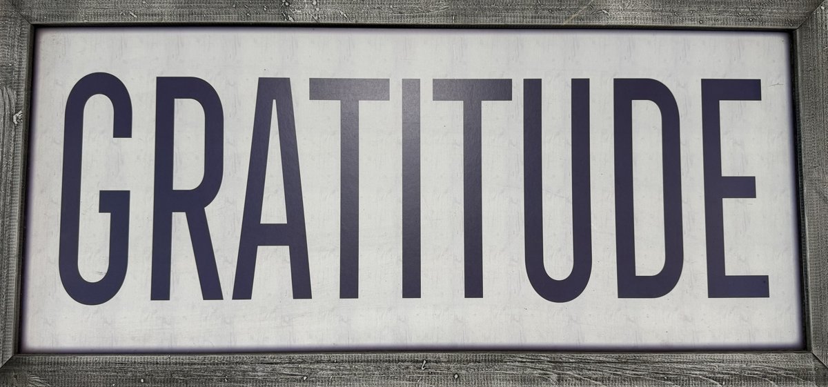 Framed sign reading Gratitude